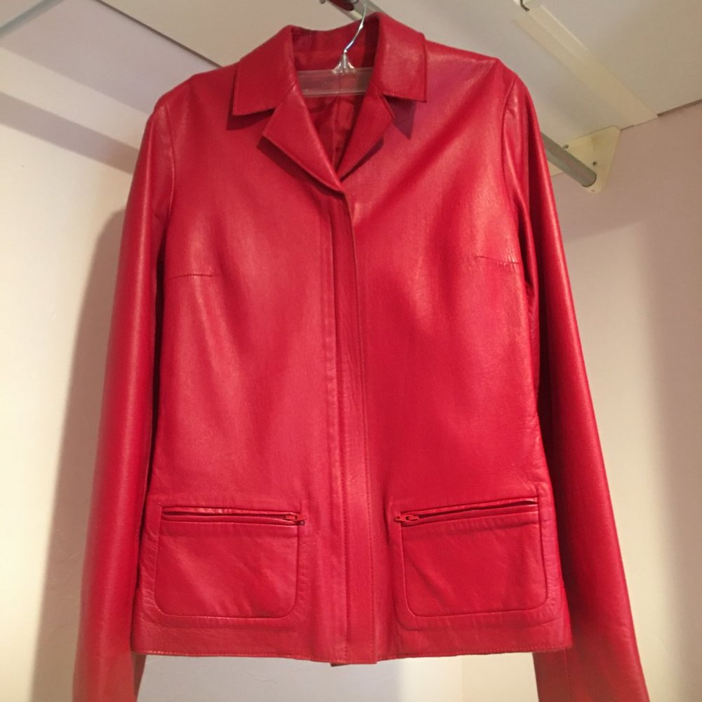 Chic Italian red leather jacket with zip front.